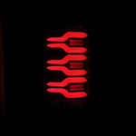 AlphaRex 14-18 GMC Sierra 1500/2500HD/3500HD LUXX-Series LED Tail Lights Blk/Red w/Actv Lgt Seq. Sig